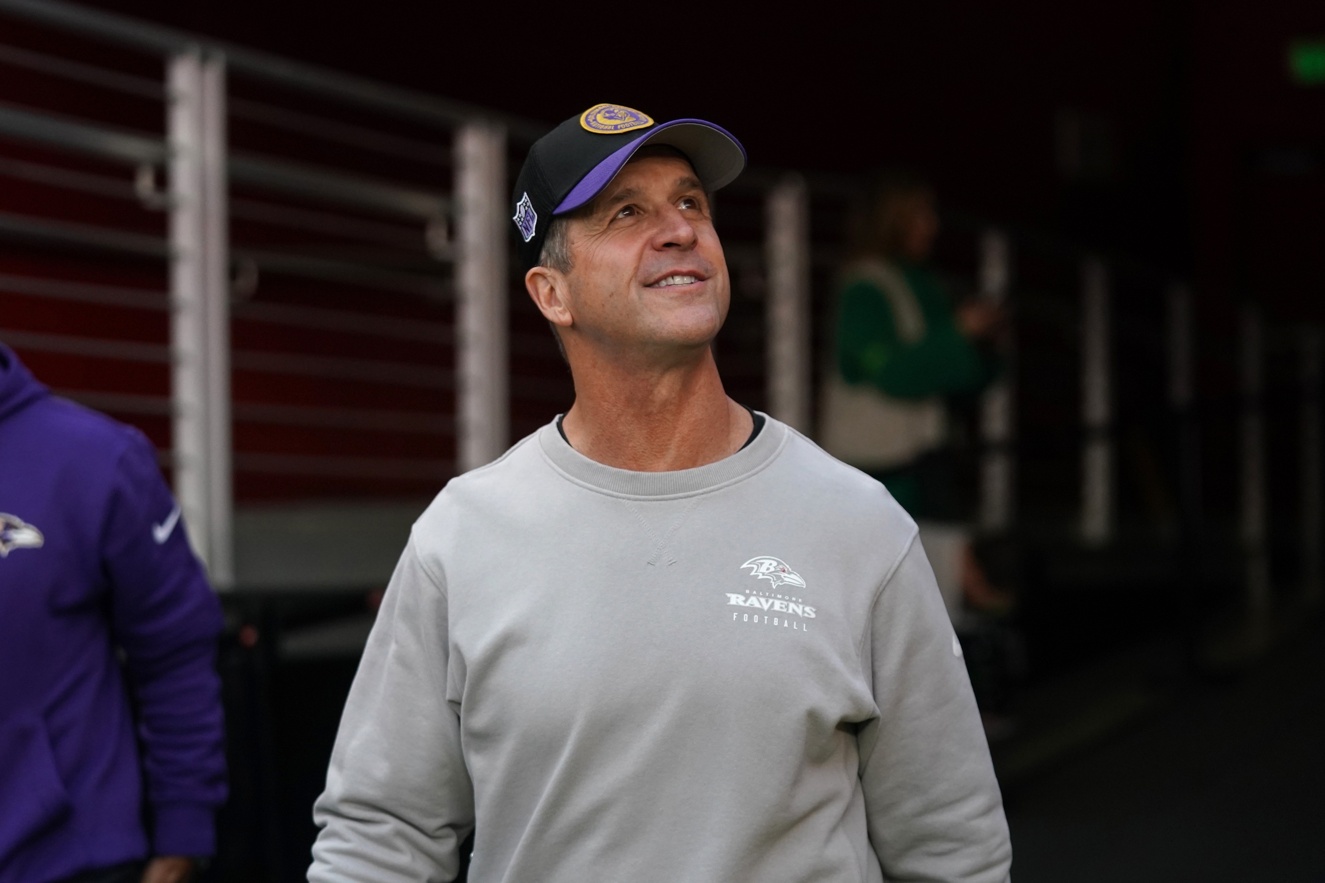Baltimore Ravens head coach John Harbaugh walks onto the field
